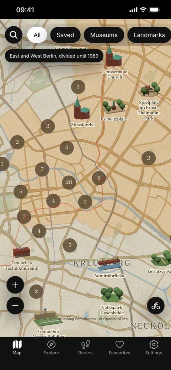 The map: Berlin in sepia and gold, the landmarks standing on it as small buildings.